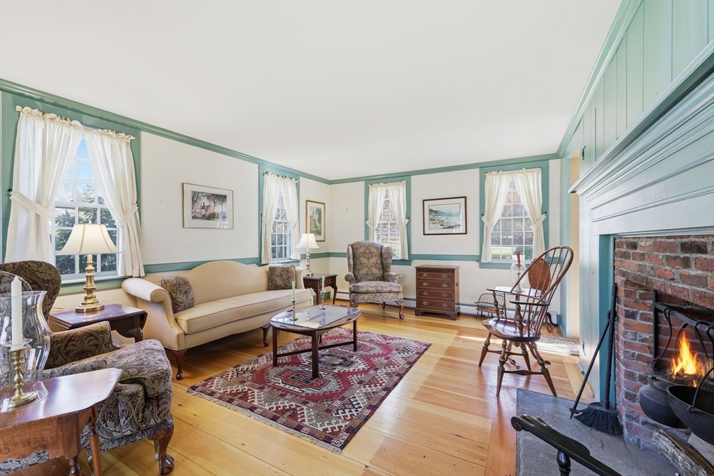 405 Rock Valley Road Holyoke, MA 01040 - Photo 12 of 42 a living room with furniture and a fireplace