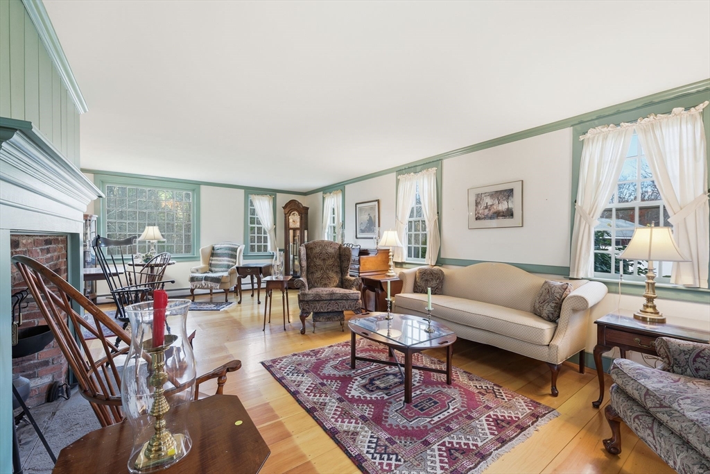 405 Rock Valley Road Holyoke, MA 01040 - Photo 13 of 42 a living room with furniture a fireplace and a large window