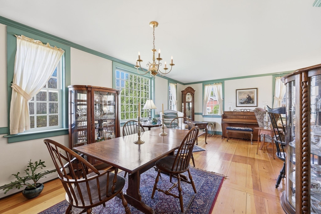 405 Rock Valley Road Holyoke, MA 01040 - Photo 15 of 42 a view of a dining room with furniture window and wooden floor