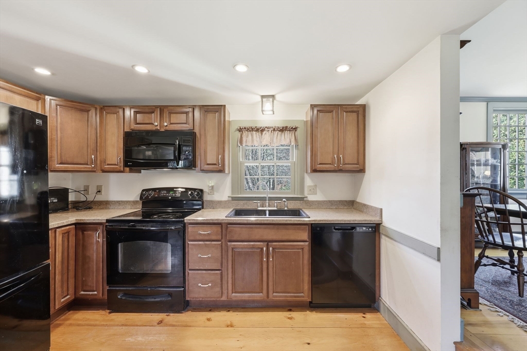 405 Rock Valley Road Holyoke, MA 01040 - Photo 16 of 42 a kitchen with a stove and a microwave