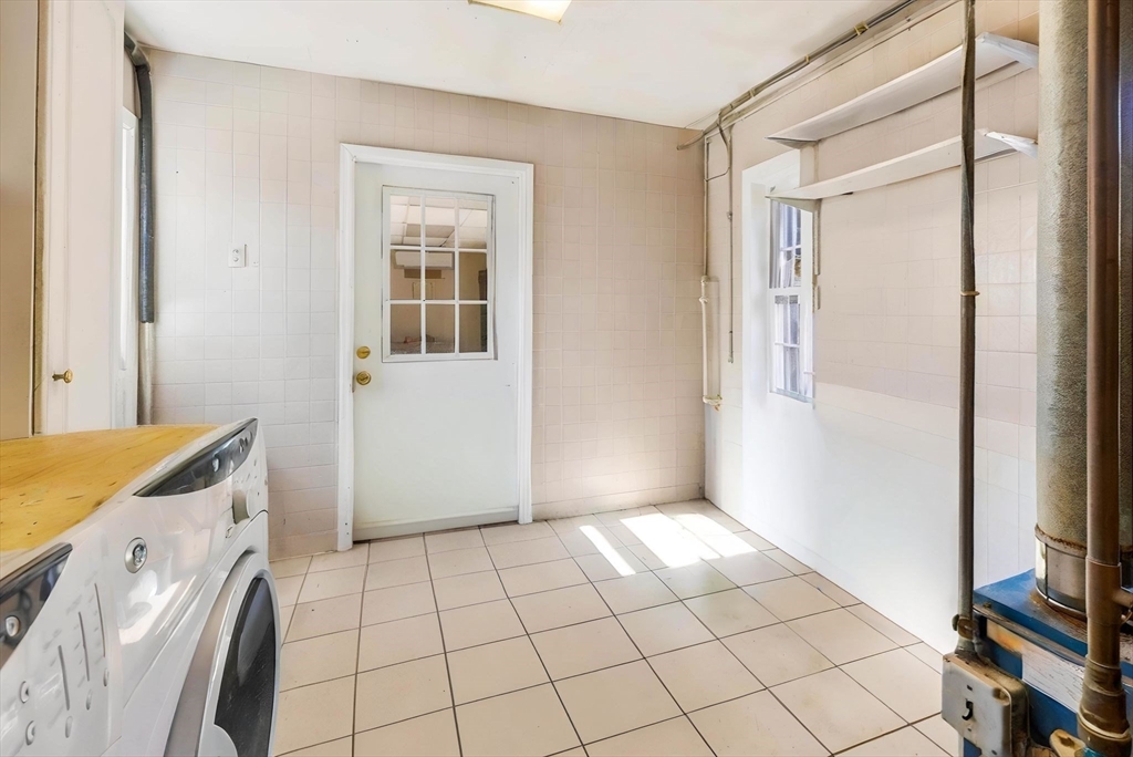 405 Rock Valley Road Holyoke, MA 01040 - Photo 36 of 42 a view of an empty room with cabinet and a window
