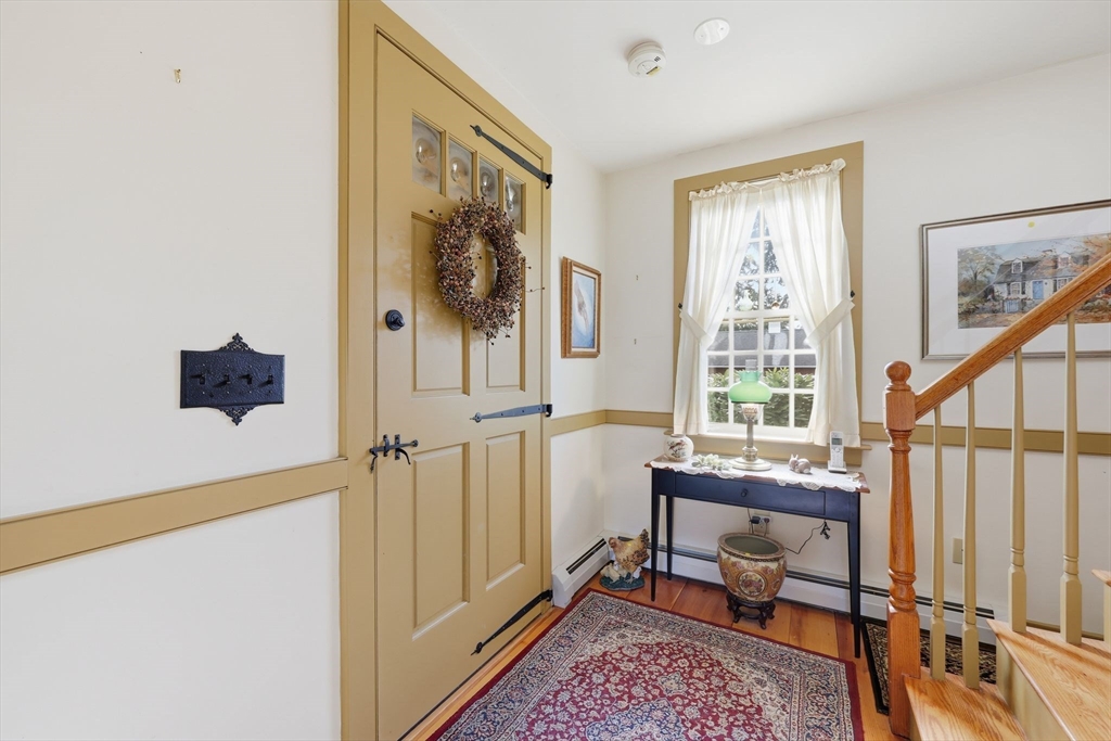 405 Rock Valley Road Holyoke, MA 01040 - Photo 9 of 42 a view of a hallway with furniture and a window