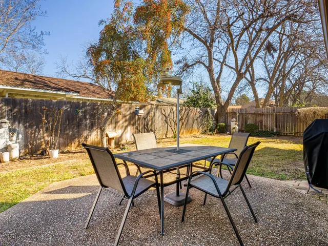 a view of a swimming pool with a patio