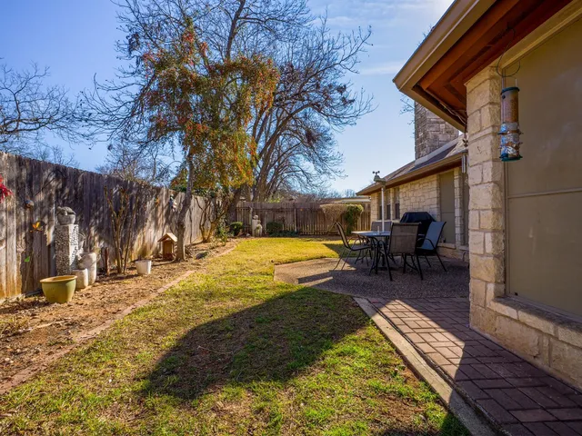 a view of swimming pool with sitting area
