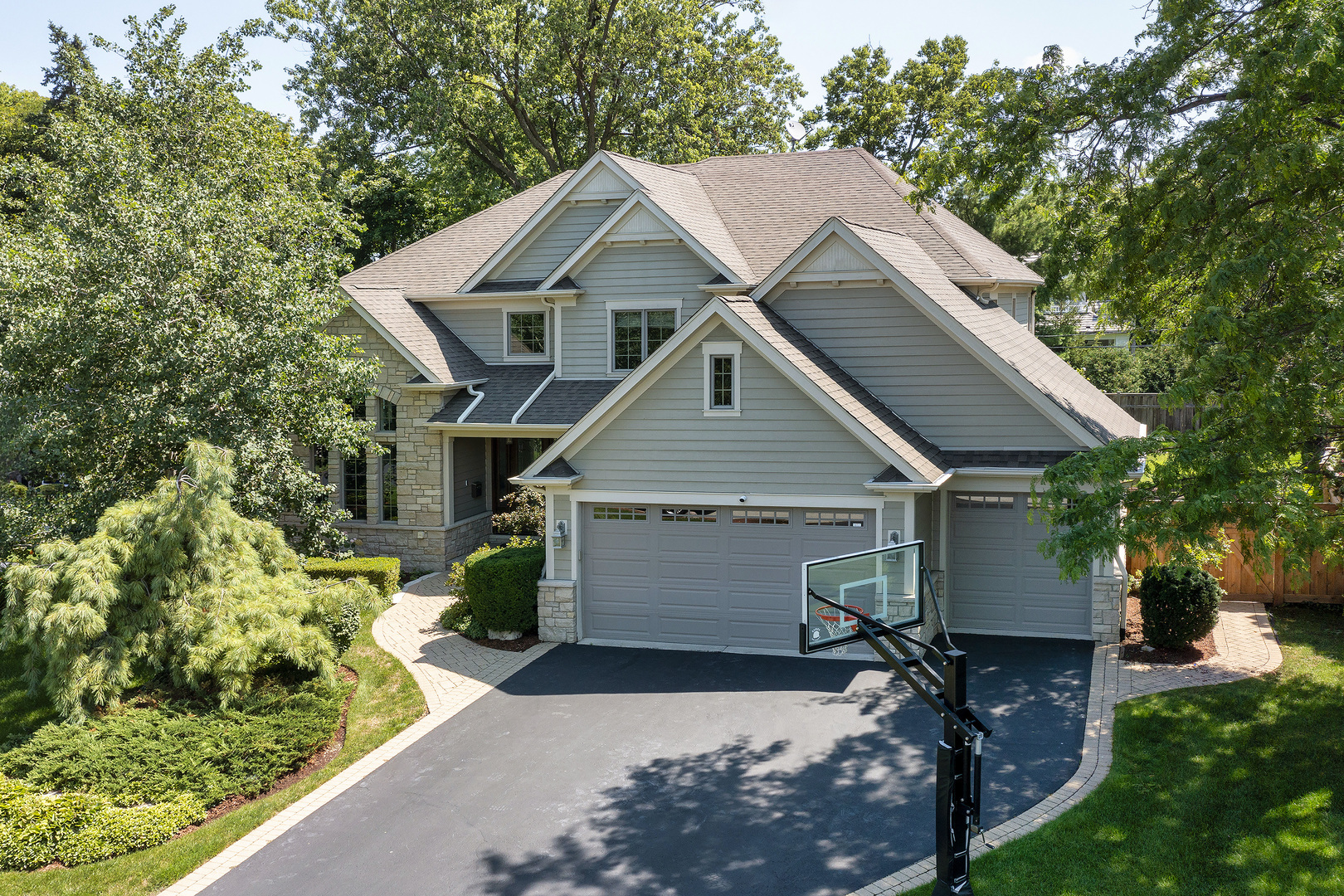 2215 Pinehurst Drive Glenview, IL 60025 - Photo 1 of 31 a front view of a house with a yard and garage