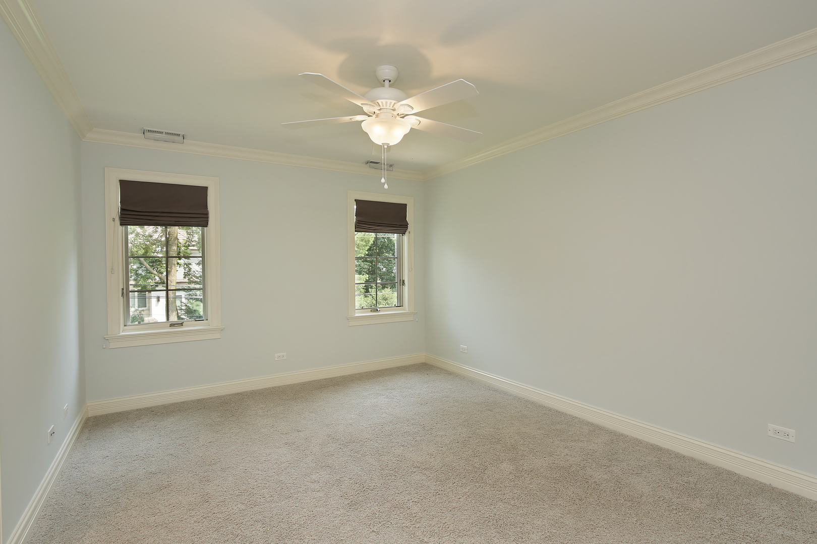 2215 Pinehurst Drive Glenview, IL 60025 - Photo 16 of 31 an empty room with windows and chandelier fan