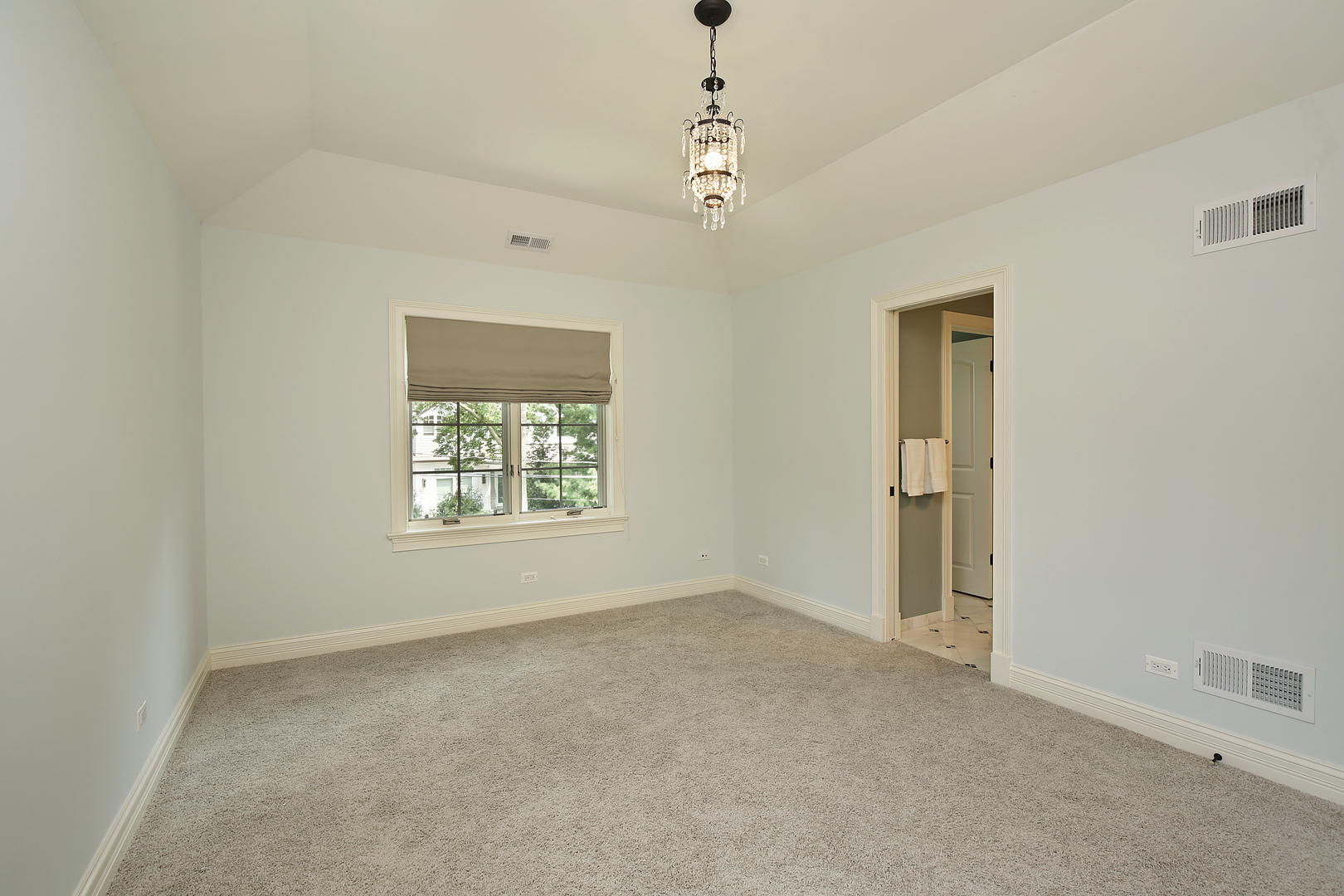 2215 Pinehurst Drive Glenview, IL 60025 - Photo 18 of 31 a big room with windows and chandelier fan