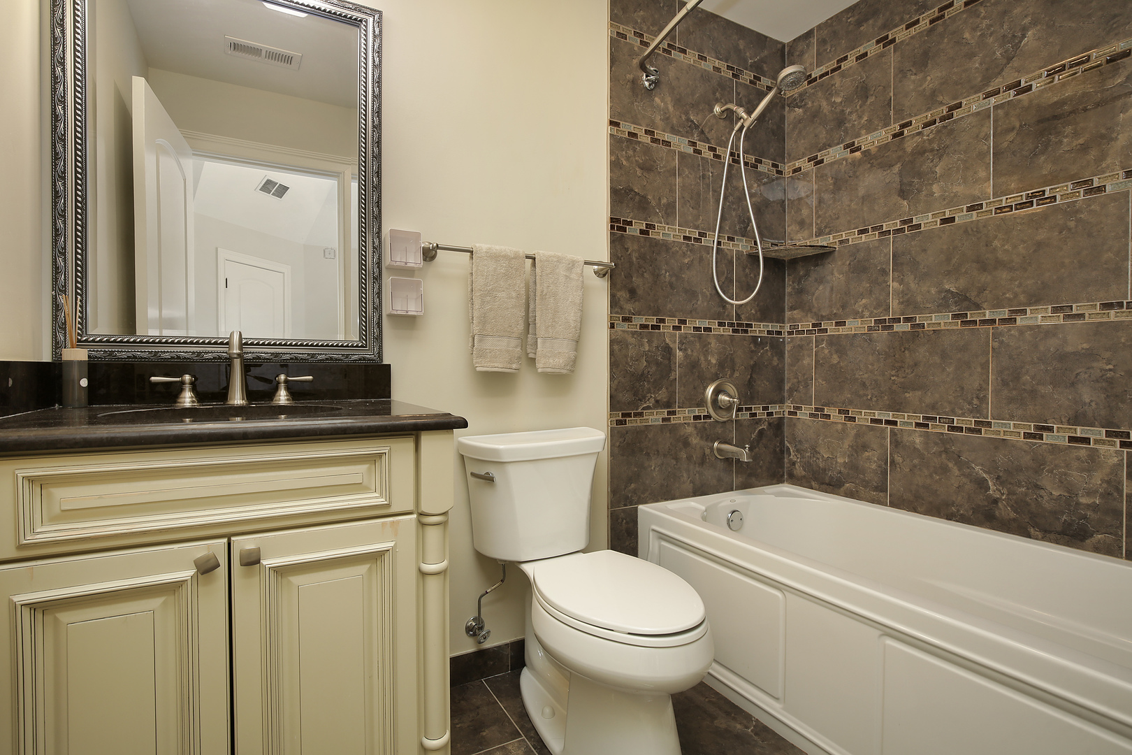 2215 Pinehurst Drive Glenview, IL 60025 - Photo 20 of 31 a bathroom with a sink a toilet and shower