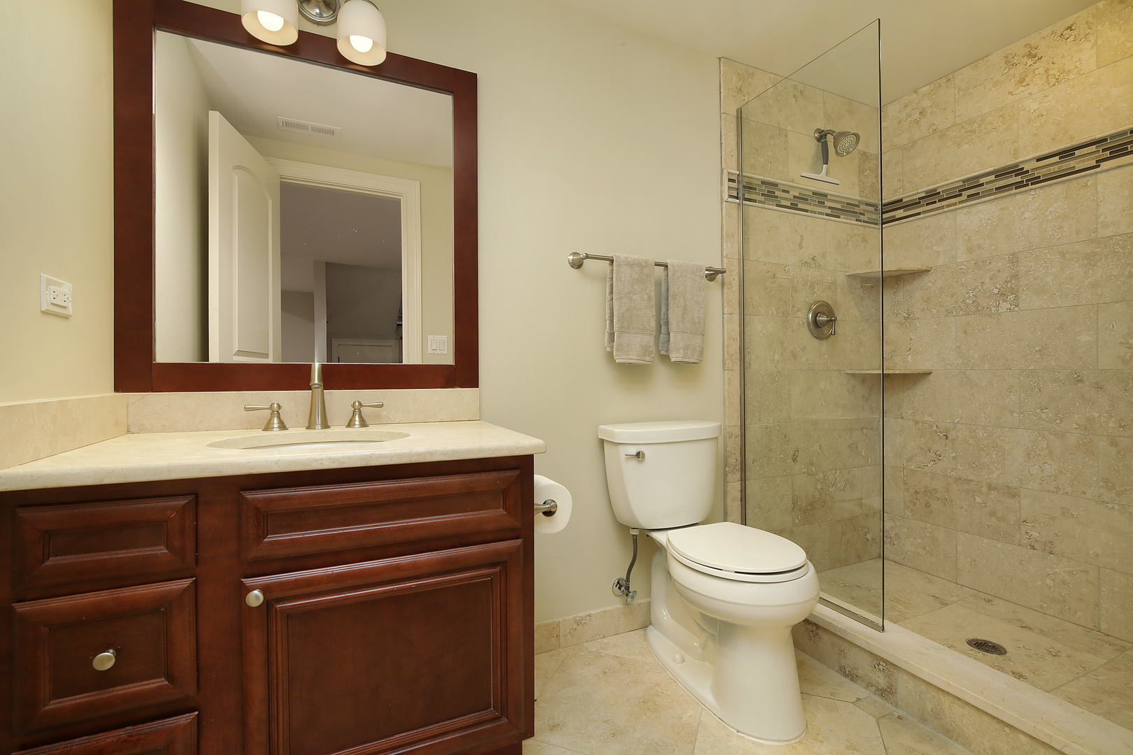 2215 Pinehurst Drive Glenview, IL 60025 - Photo 23 of 31 a bathroom with a sink a toilet and shower