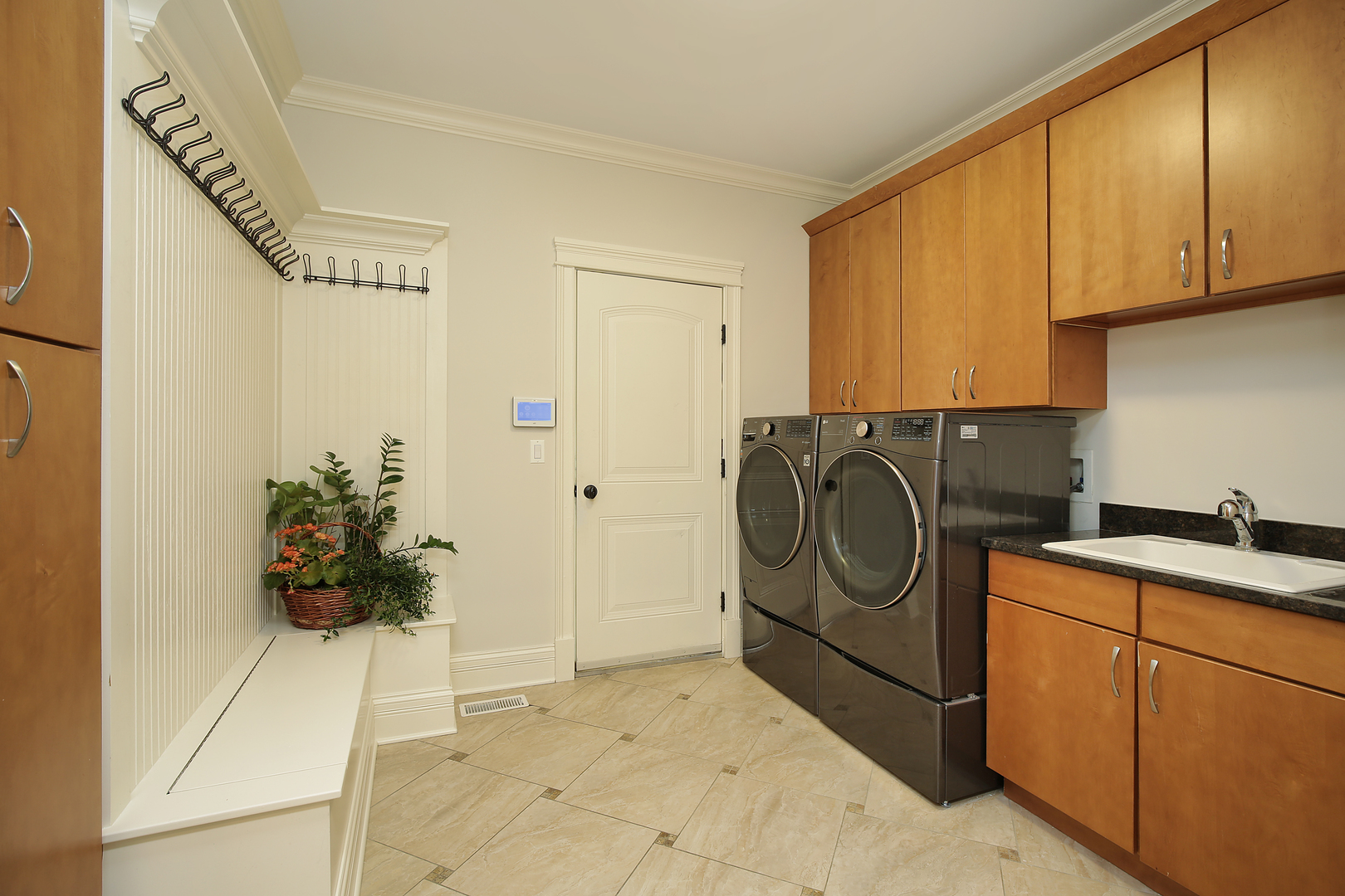 2215 Pinehurst Drive Glenview, IL 60025 - Photo 24 of 31 a utility room with sink dryer and washer