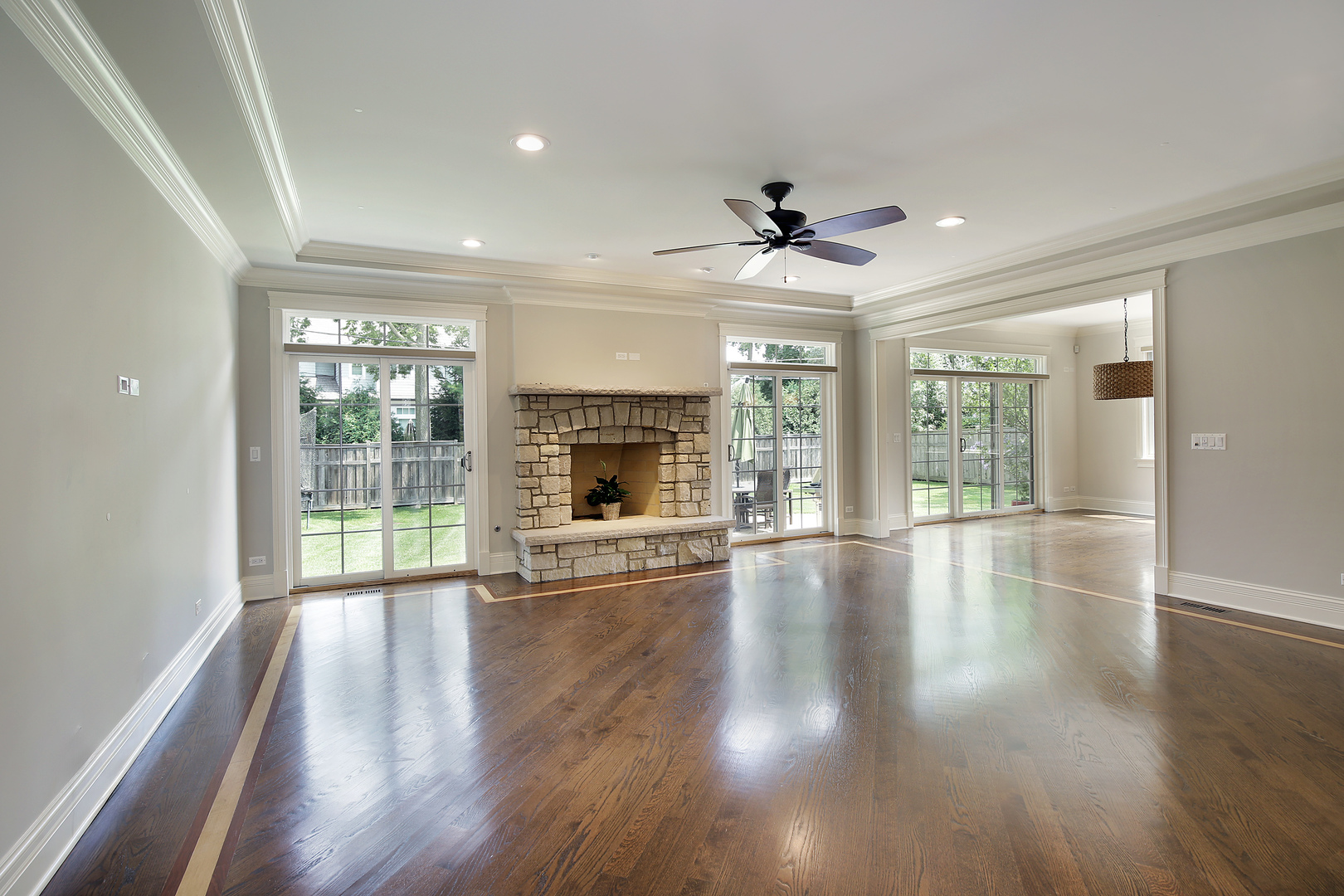 2215 Pinehurst Drive Glenview, IL 60025 - Photo 9 of 31 a view of an empty room with wooden floor and a fireplace