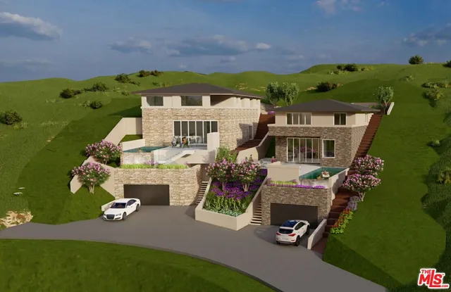 an aerial view of a house with a yard