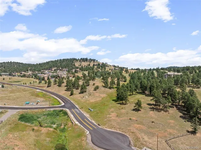 an aerial view of swimming pool and mountain view