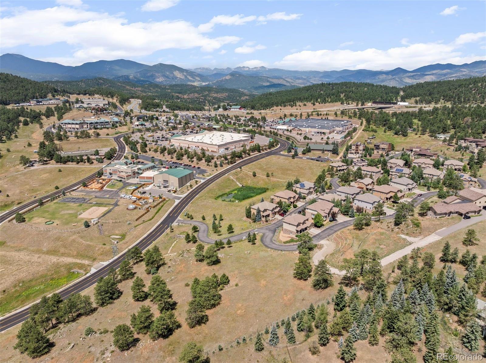 1162 Swede Gulch Road Evergreen, CO 80439 - Photo 25 of 27 a view of a city with a mountain