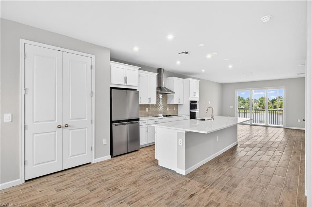 4596 Arboretum Circle, Unit 202 Naples, FL 34112 - Photo 3 of 24 Pantry next to kitchen