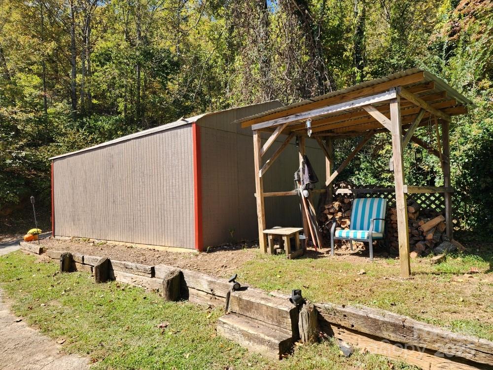 41 Gunches Dirt Road Candler, NC 28715 - Photo 11 of 33 a backyard of a house with barbeque oven