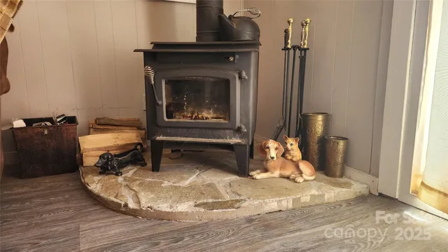 a room with a fireplace and wooden floor