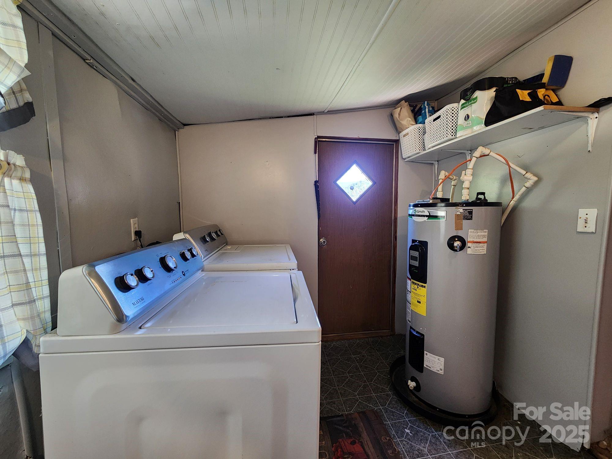 41 Gunches Dirt Road Candler, NC 28715 - Photo 27 of 33 a utility room with dryer and washer