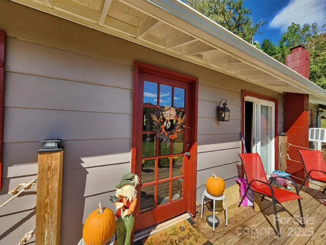 a view of a chairs and table in the balcony
