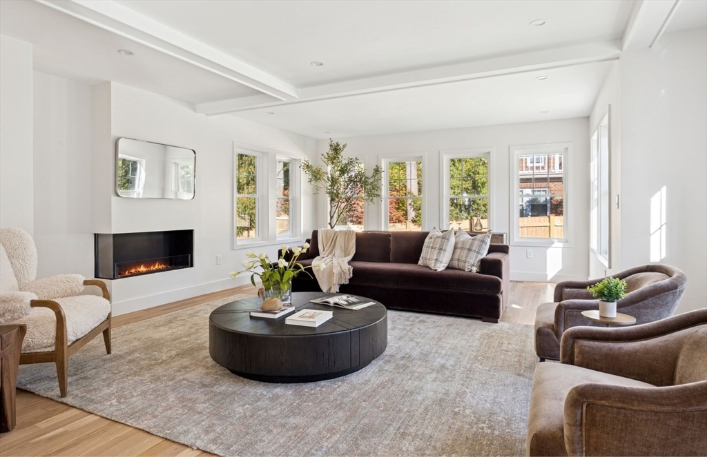 873 Chestnut Street Newton, MA 02468 - Photo 15 of 22 a living room with furniture and a fireplace