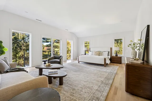 a bedroom with a large bed and a couch