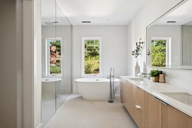 a bathroom with a bathtub and shower
