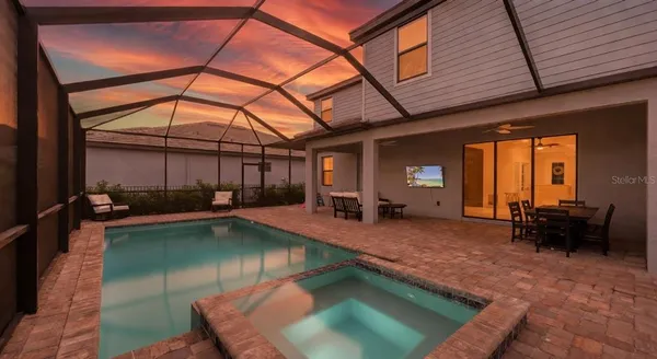 an aerial view of a pool patio swimming pool and outdoor seating