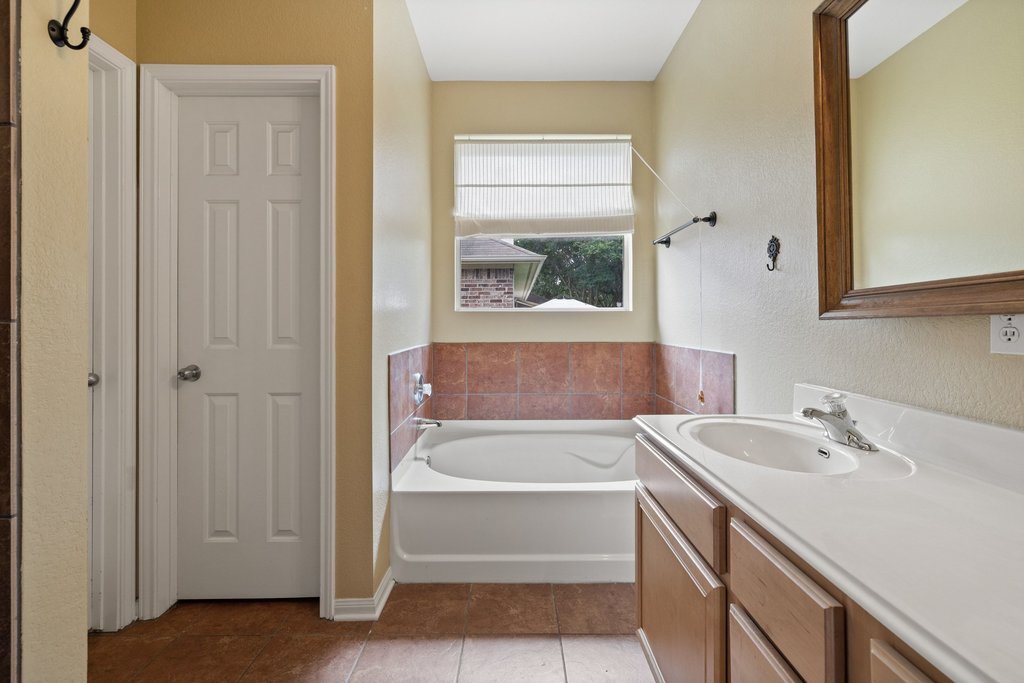 347 Spring Drive Kyle, TX 78640 - Photo 31 of 40 A well-lit bathroom provides a comfortable and functional space for daily routines.