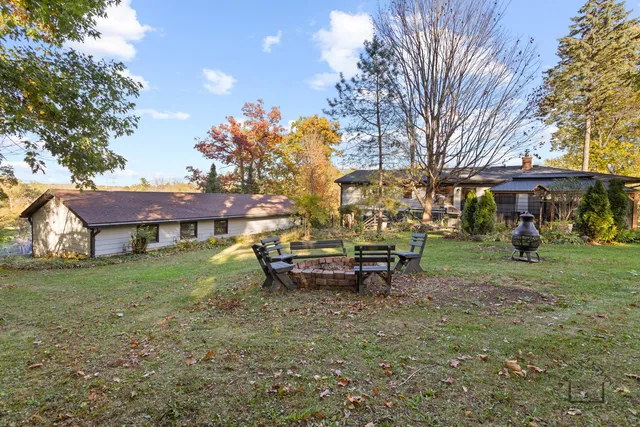 a view of a house with a yard porch and sitting area