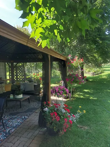 a view of a porch with furniture