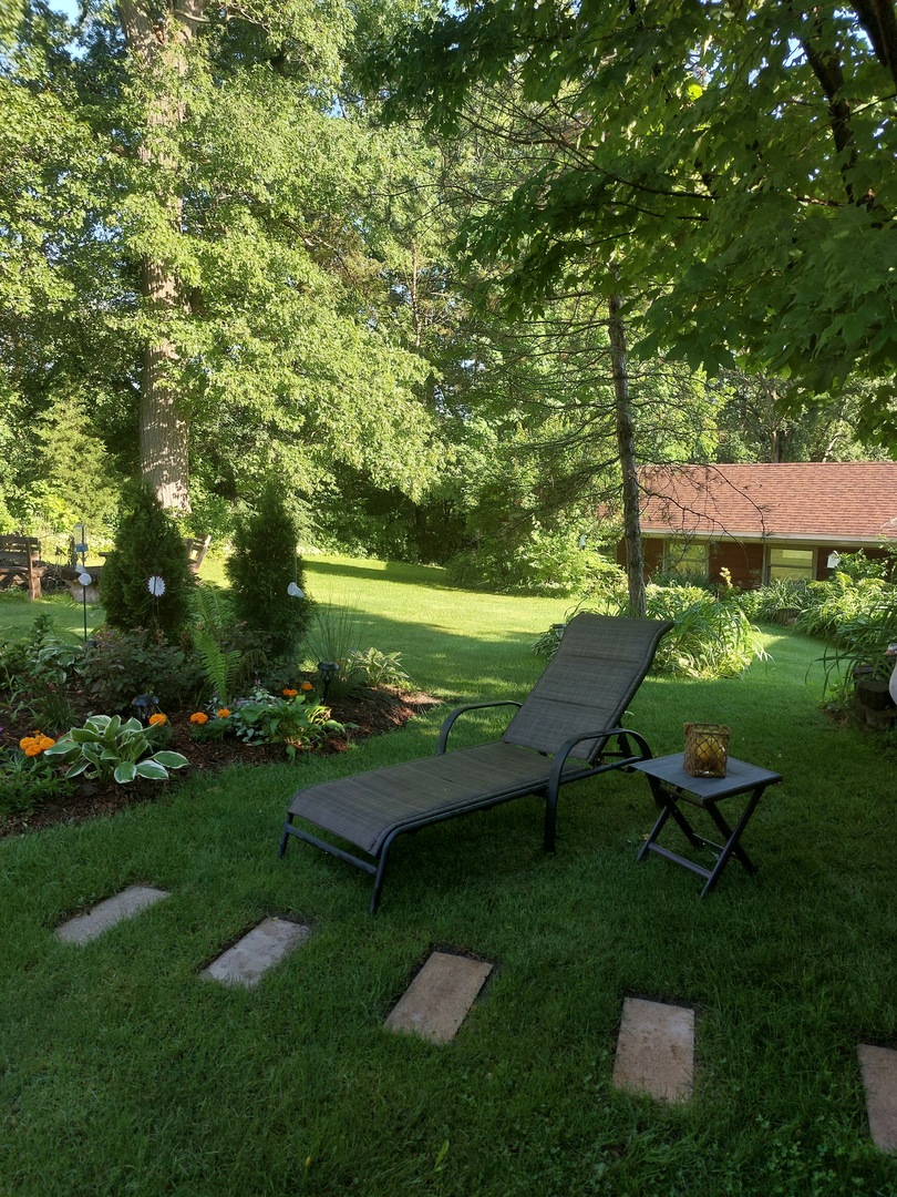 400 Crestview Drive Fox River Grove, IL 60021 - Photo 36 of 48 a view of a garden with plants and large trees