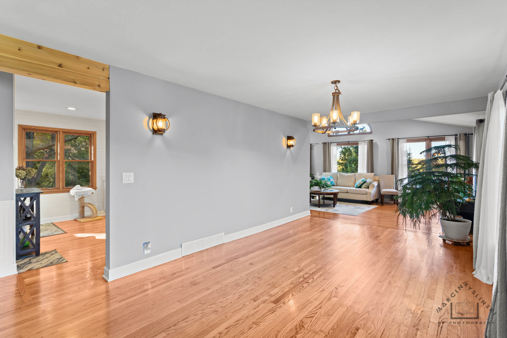 400 Crestview Drive Fox River Grove, IL 60021 - Photo 6 of 48 a view of a livingroom with furniture wooden floor and a chandelier