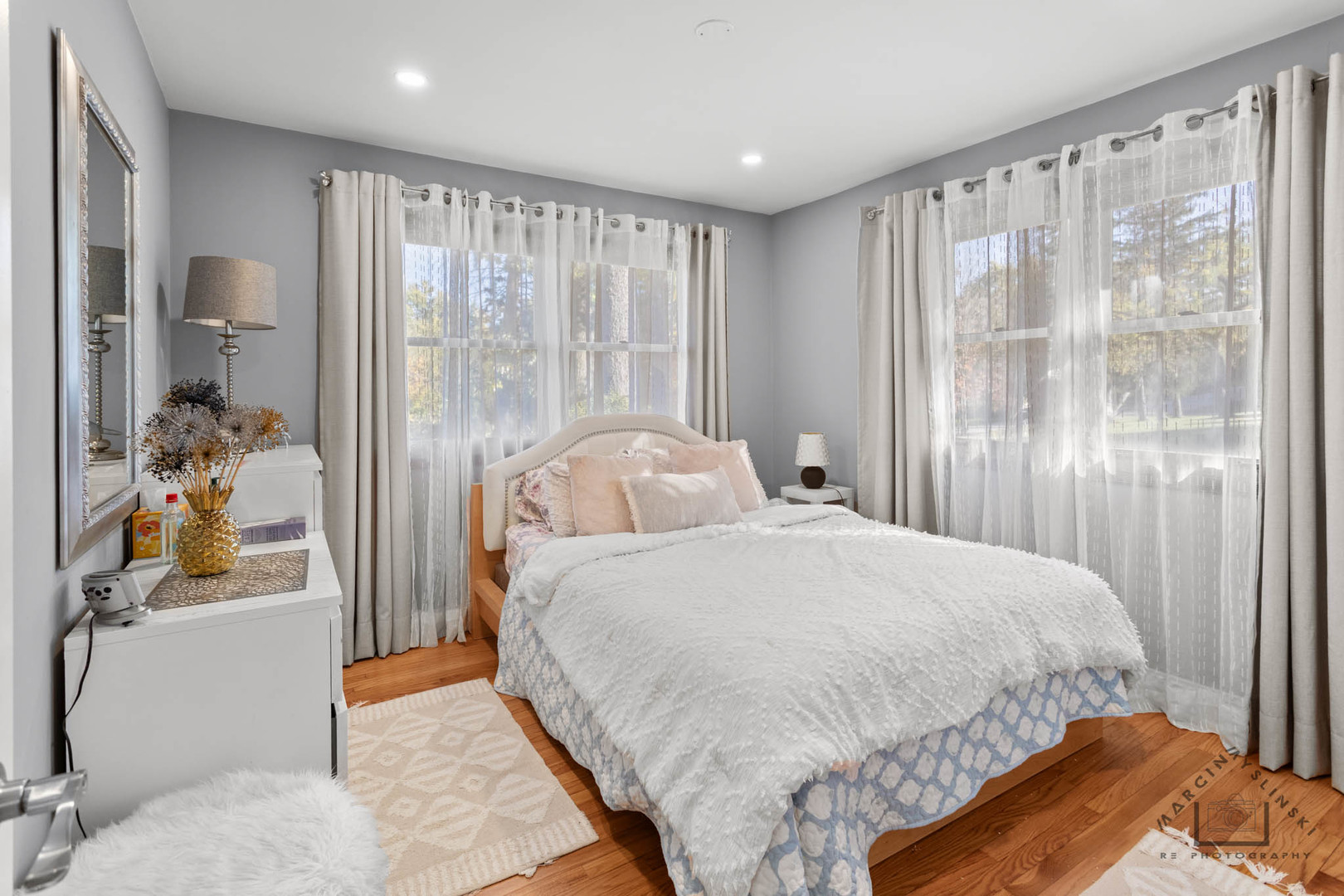 400 Crestview Drive Fox River Grove, IL 60021 - Photo 7 of 48 a bedroom with a bed and a large mirror