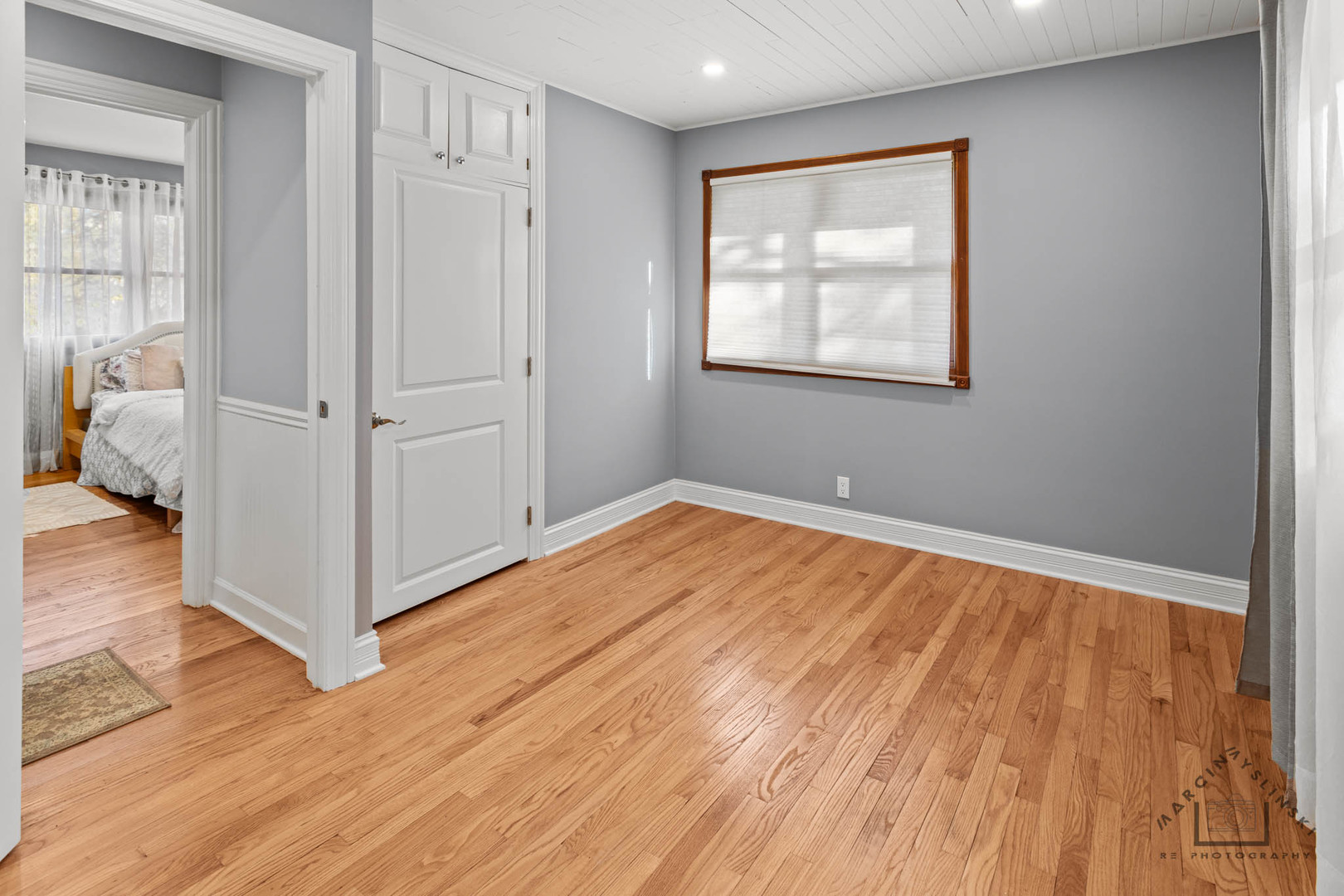400 Crestview Drive Fox River Grove, IL 60021 - Photo 8 of 48 a view of an empty room with wooden floor and a window