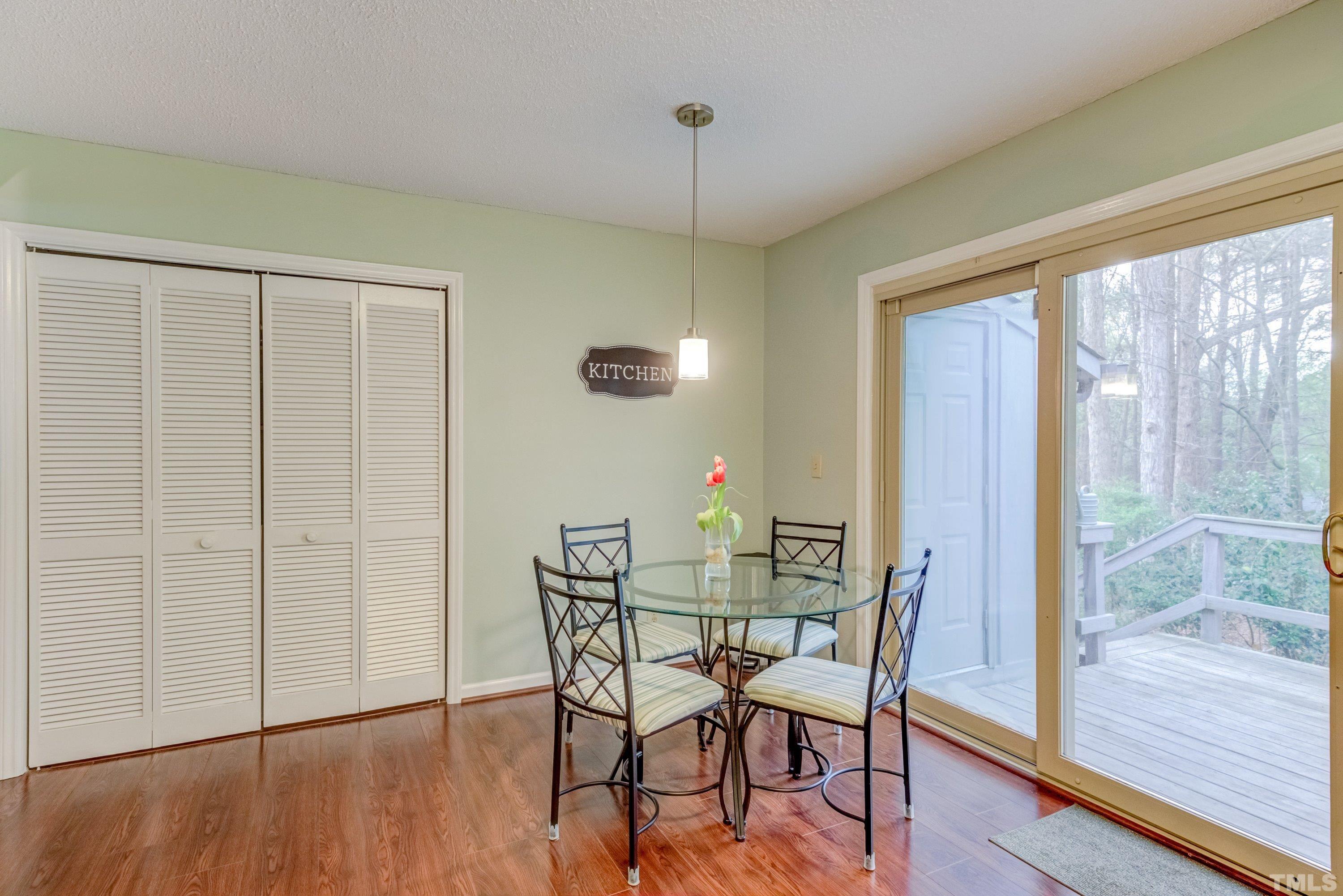 6806 Ray Road Raleigh, NC 27613 - Photo 9 of 32 a view of a dining room with furniture window and wooden floor