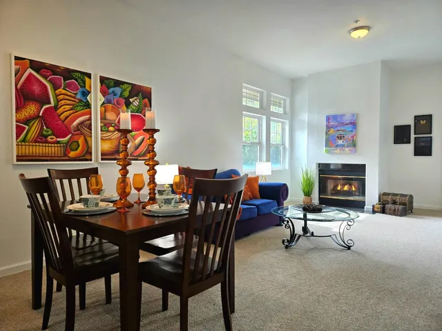 a dining room with furniture and window