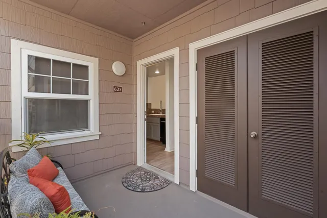 a view of porch with a table and chair