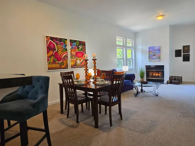 a view of a livingroom with furniture and a fireplace