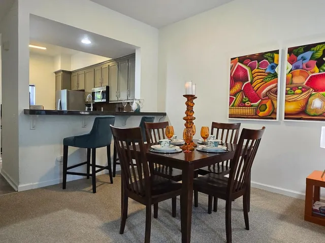 a view of a dining room with furniture