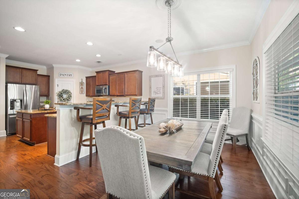 106 Danbury Court Pooler, GA 31322 - Photo 13 of 33 a view of a dining room with furniture window and wooden floor