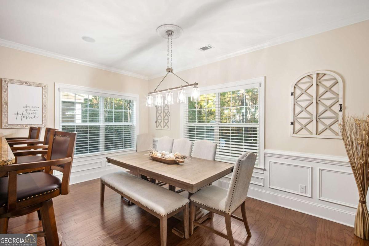 106 Danbury Court Pooler, GA 31322 - Photo 14 of 33 a view of a dining room with furniture window and wooden floor