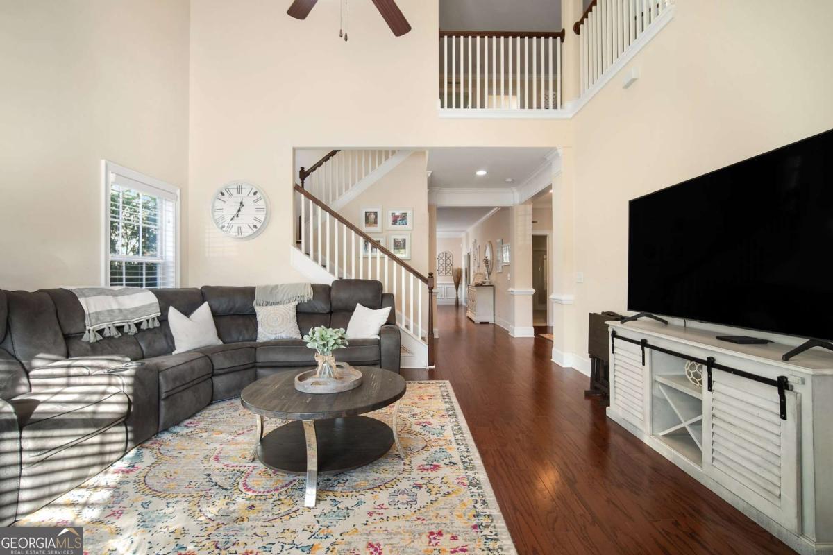 106 Danbury Court Pooler, GA 31322 - Photo 10 of 33 a living room with furniture and a flat screen tv