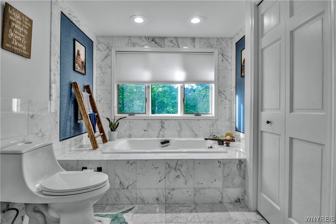 5555 Kraus Road Clarence, NY 14031 - Photo 32 of 50 Marble Tiled Jacuzzi Tub