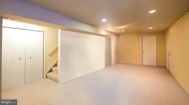a bathroom with a sink and mirror with toilet