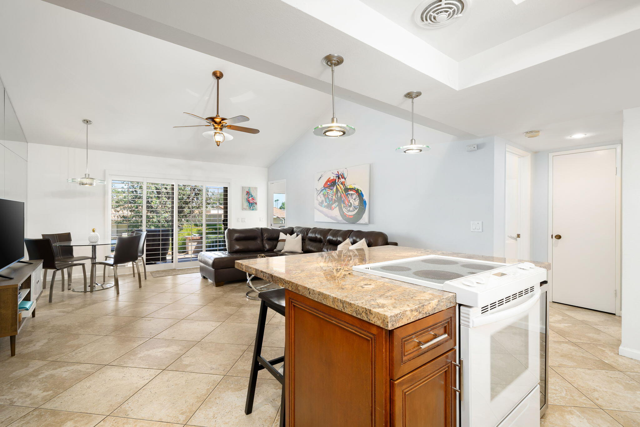 40960 La Costa Circle West Palm Desert, CA 92211 - Photo 11 of 45 a kitchen with a stove a table and chairs in it