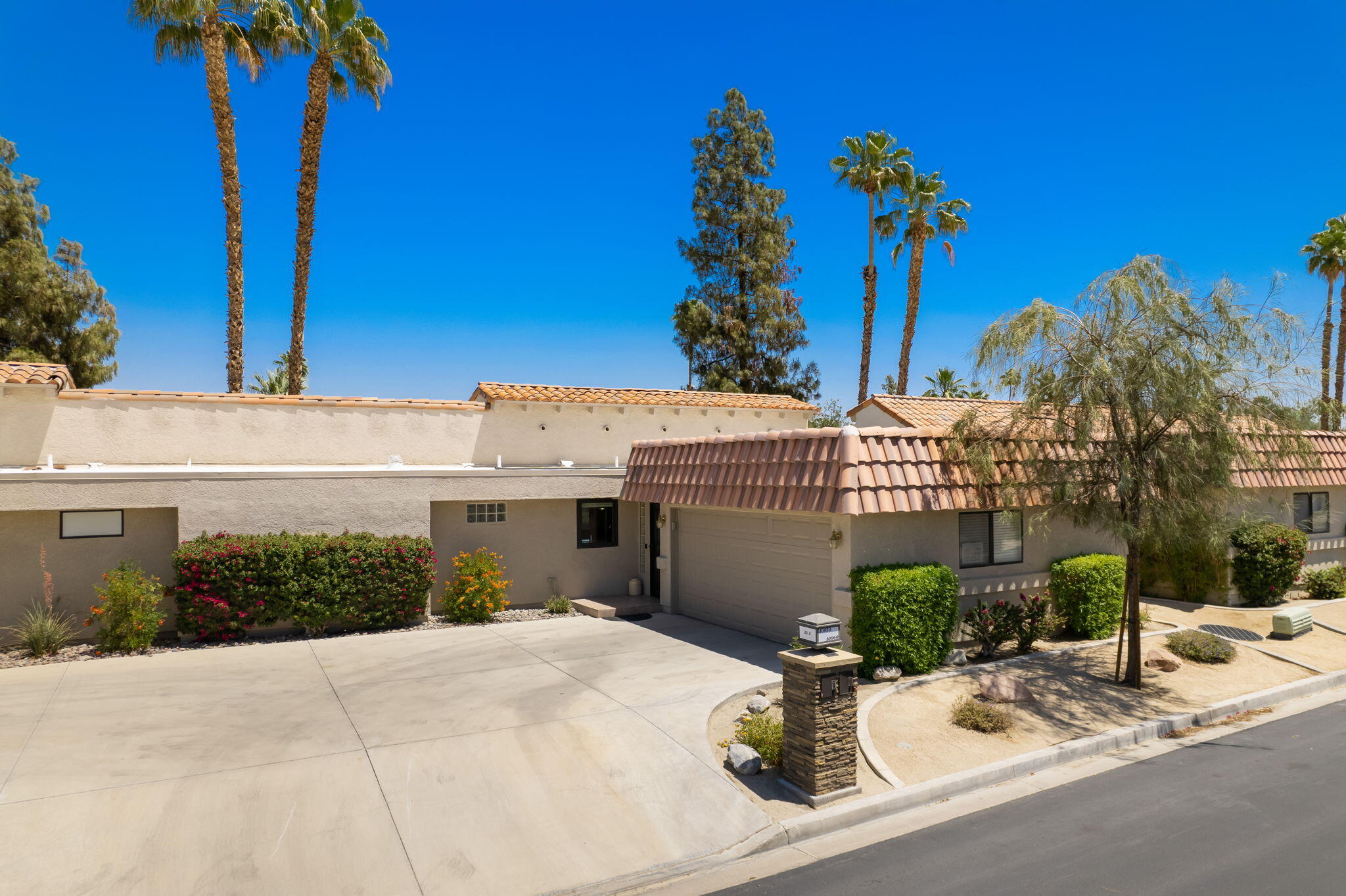 40960 La Costa Circle West Palm Desert, CA 92211 - Photo 39 of 45 a view of a house with a yard and potted plants