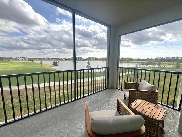 a view of balcony with furniture