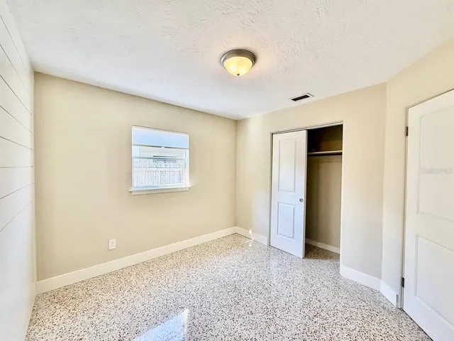 a view of livingroom with an empty space and a window