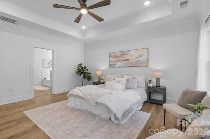 9729 B Flowes Store Road, Unit 2 Midland, NC 28107 - Photo 14 of 22 a spacious bedroom with a bed and a couch