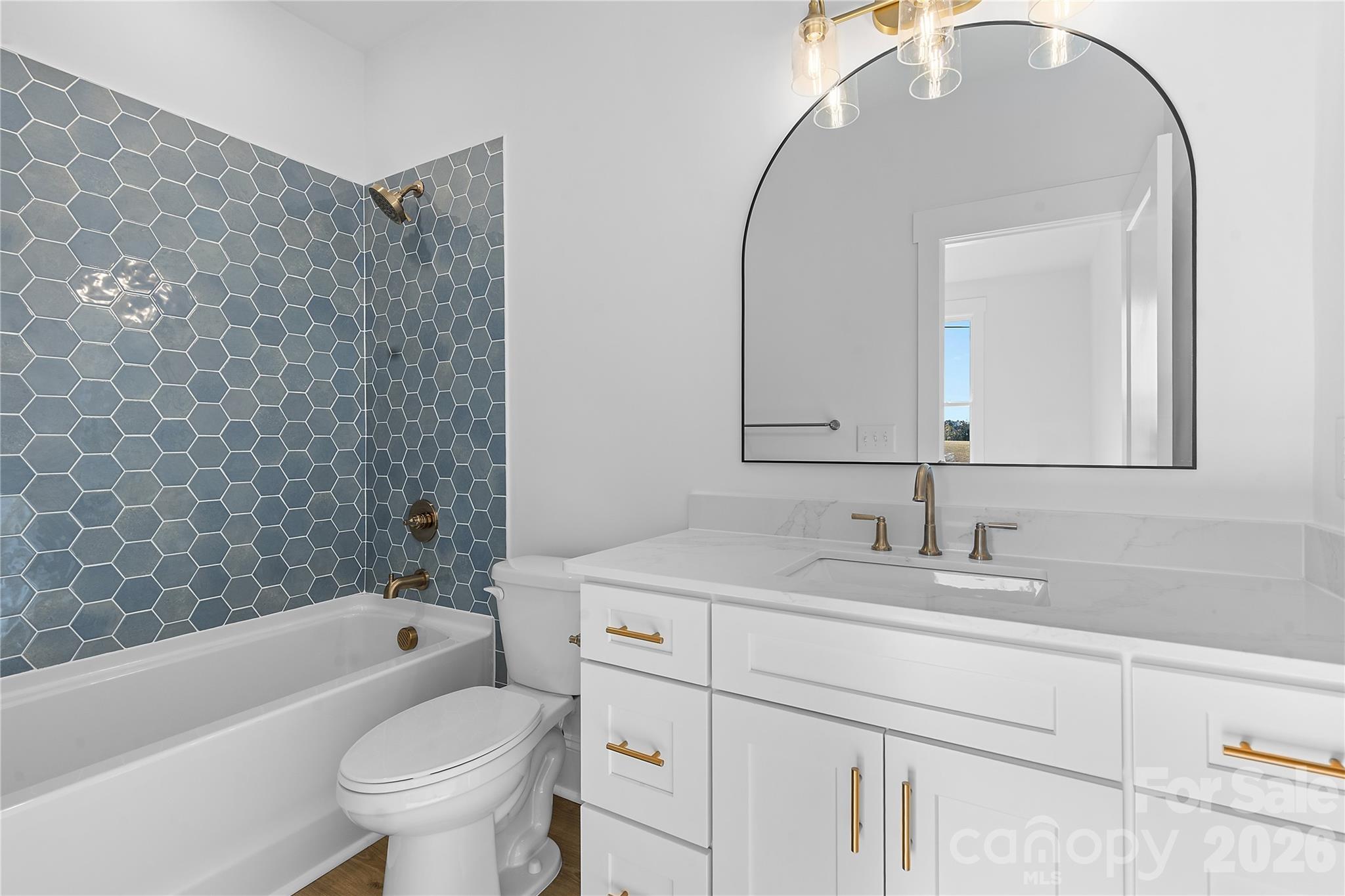 9729 B Flowes Store Road, Unit 2 Midland, NC 28107 - Photo 17 of 22 a bathroom with a sink and a mirror